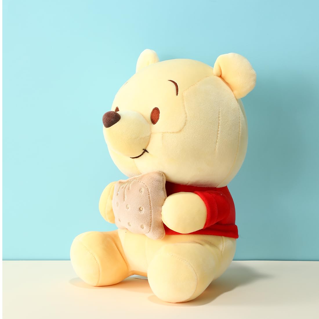 MINISO Winnie-The-Pooh Stuffed Animals Plush Toy Sitting Holding Biscuits, Soft Cute Ideal Gift Doll for Sleeping and Decoration