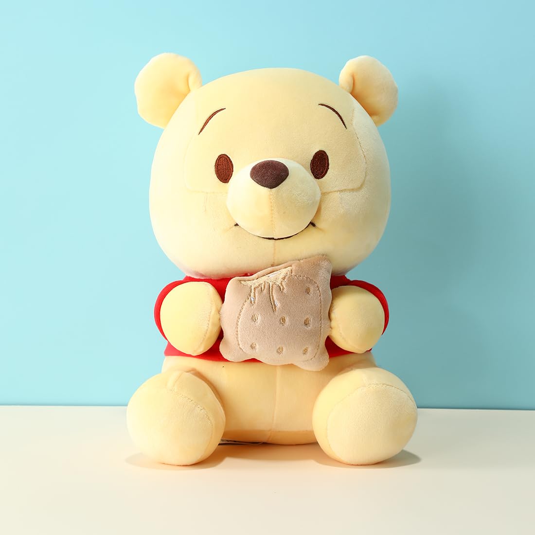 MINISO Winnie-The-Pooh Stuffed Animals Plush Toy Sitting Holding Biscuits, Soft Cute Ideal Gift Doll for Sleeping and Decoration