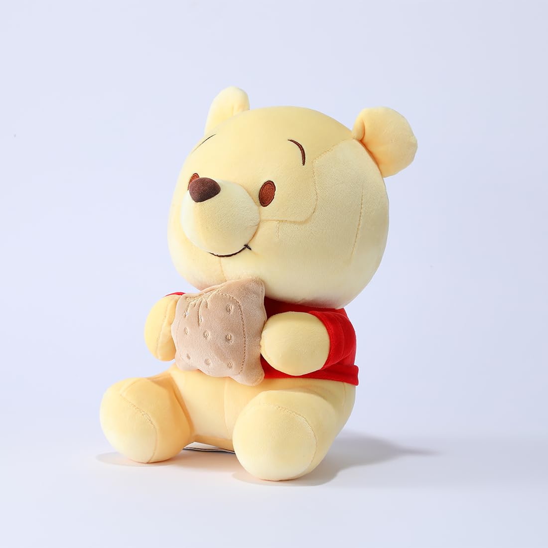 MINISO Winnie-The-Pooh Stuffed Animals Plush Toy Sitting Holding Biscuits, Soft Cute Ideal Gift Doll for Sleeping and Decoration
